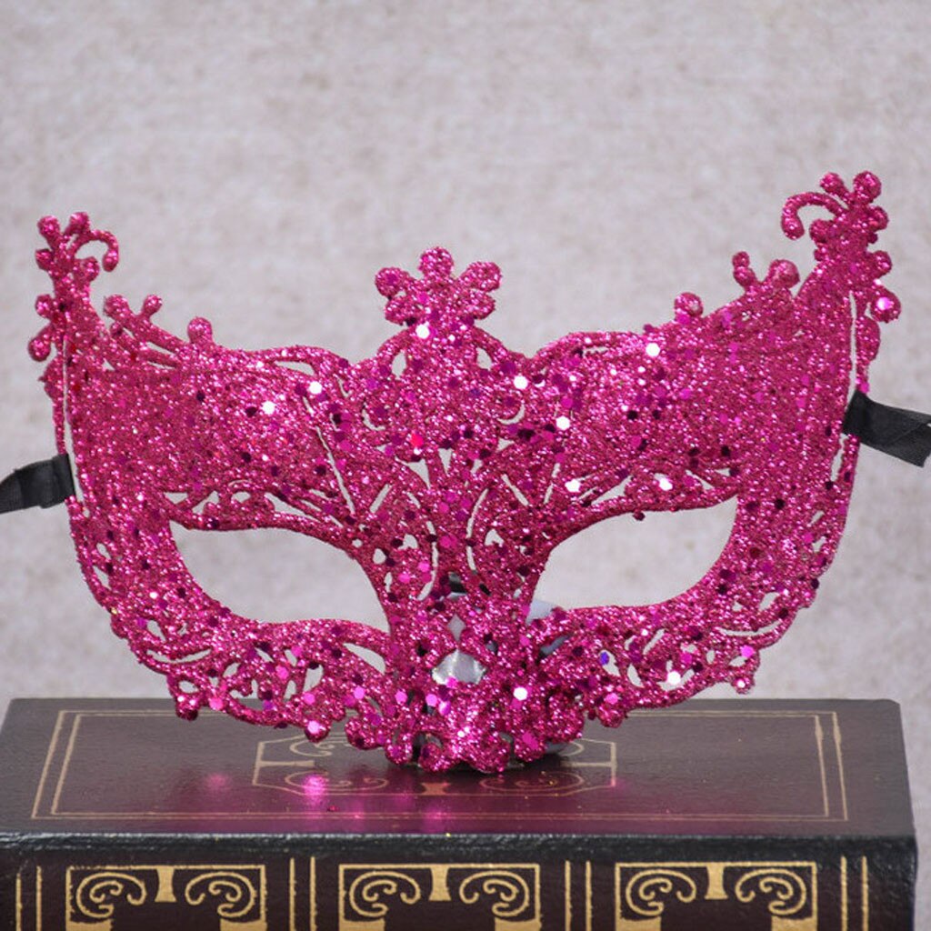 Masque loup vénitien en dentelle rose fuchsia avec paillettes et motifs floraux, décor baroque