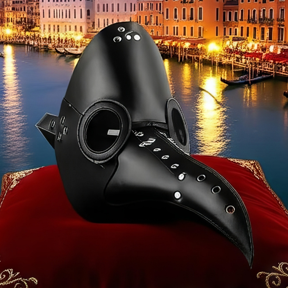 Masque Commedia Dell’Arte Médecin De La Peste noir en cuir avec rivets argentés et lunettes rondes, posé sur coussin rouge